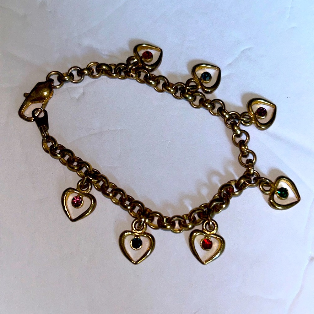 14 KT GF HEART CHARM BRACELET WITH HEARTS AND DIFFERENT COLORED RHINESTONES